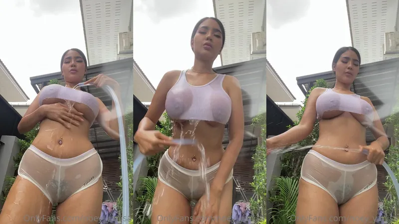 Navel pierced Noey_Yanisa seduces outdoors with a water-filled hose