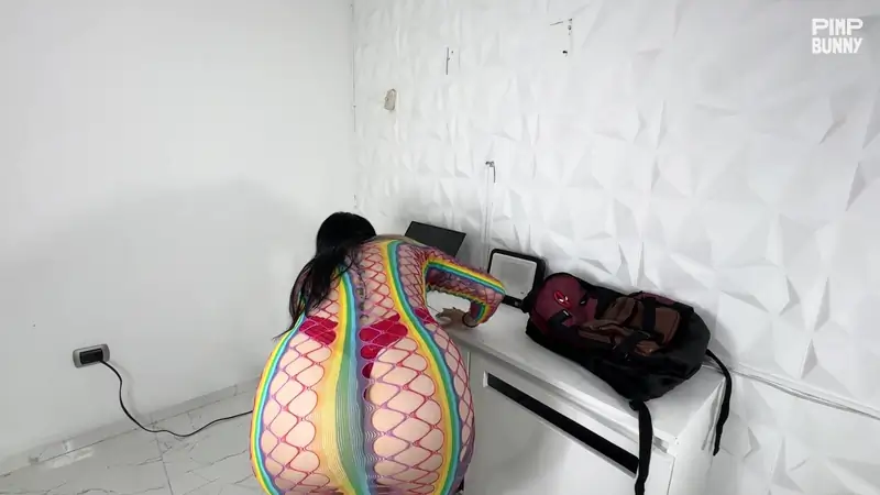 Zoe Sarah's fishnets and red lingerie get her off in a hot strip show