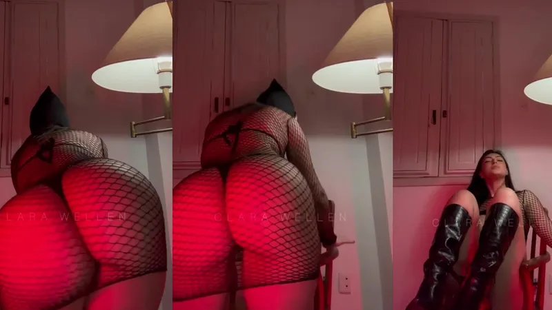 Clara Wellen teases her sexy body with tattoos & fishnets in a steamy striptease